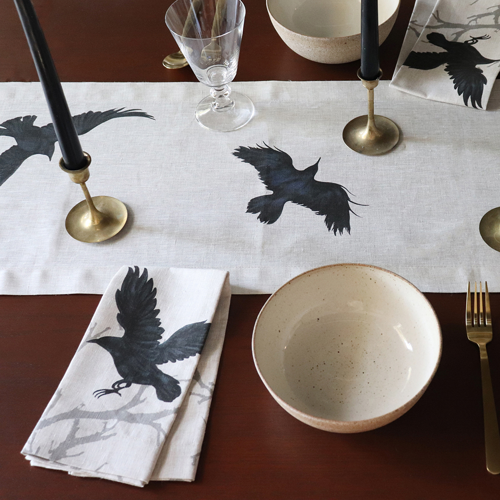 Natural table linens with Crow print by Huddleson