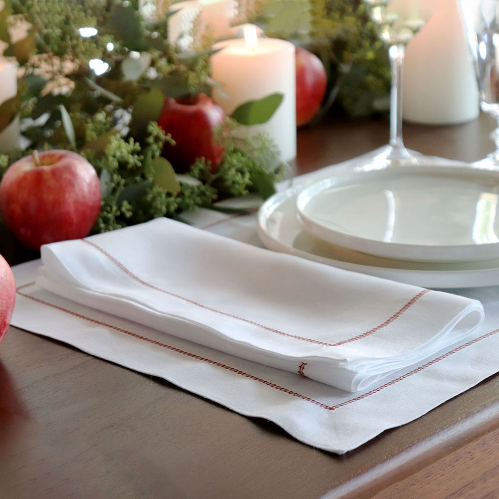 White hemstitched linen napkin placemat set red trim Christmas placesetting