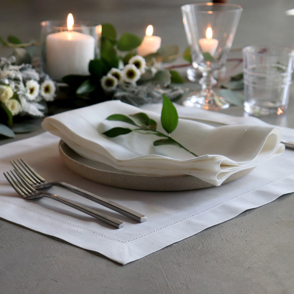 Hemstitched ivory linen placemat and napkin placesetting 