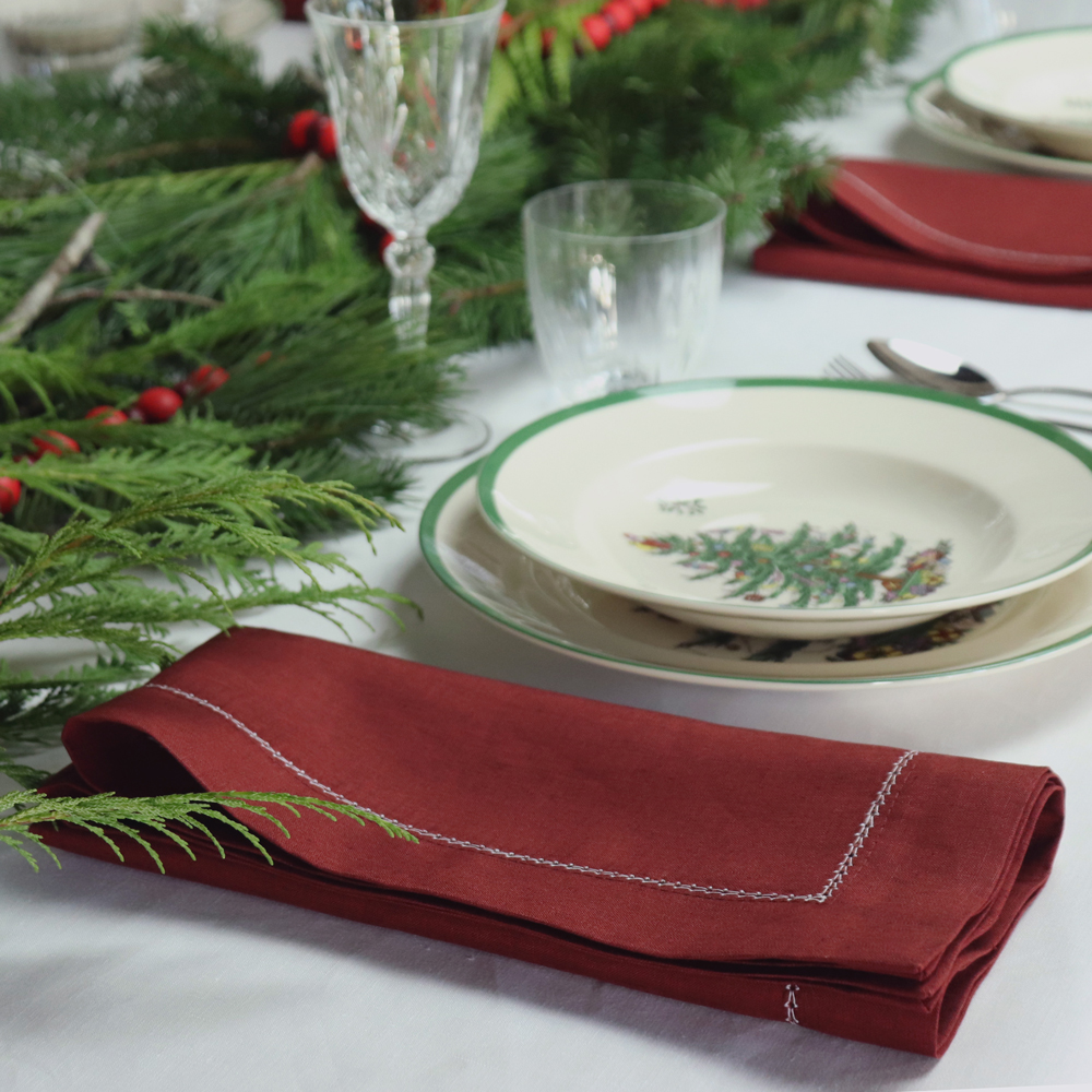 Christmas table setting burgundy hemstitched linen napkin